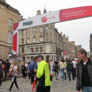 People are wondering on the High Street in Edinburgh